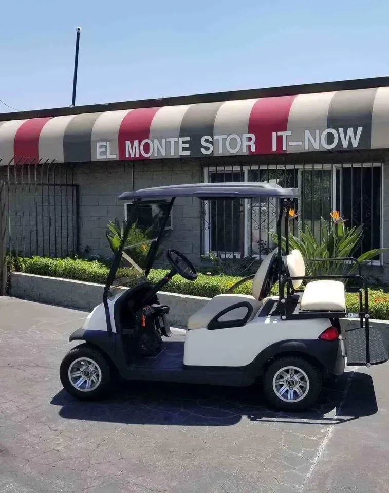 A golf cart parked outside of the El Monte Stor It-Now facility